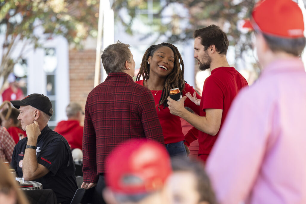 A group of people talking and laughing
