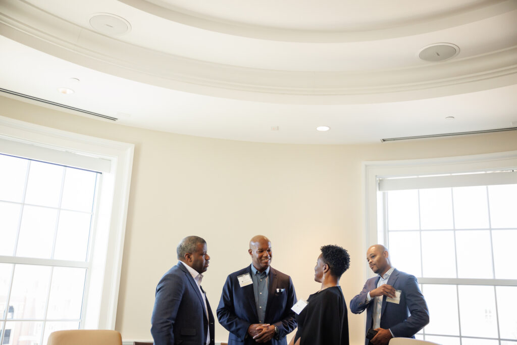 2024 Terry Trailblazers greet each other casually before the beginning of the student roundtable.