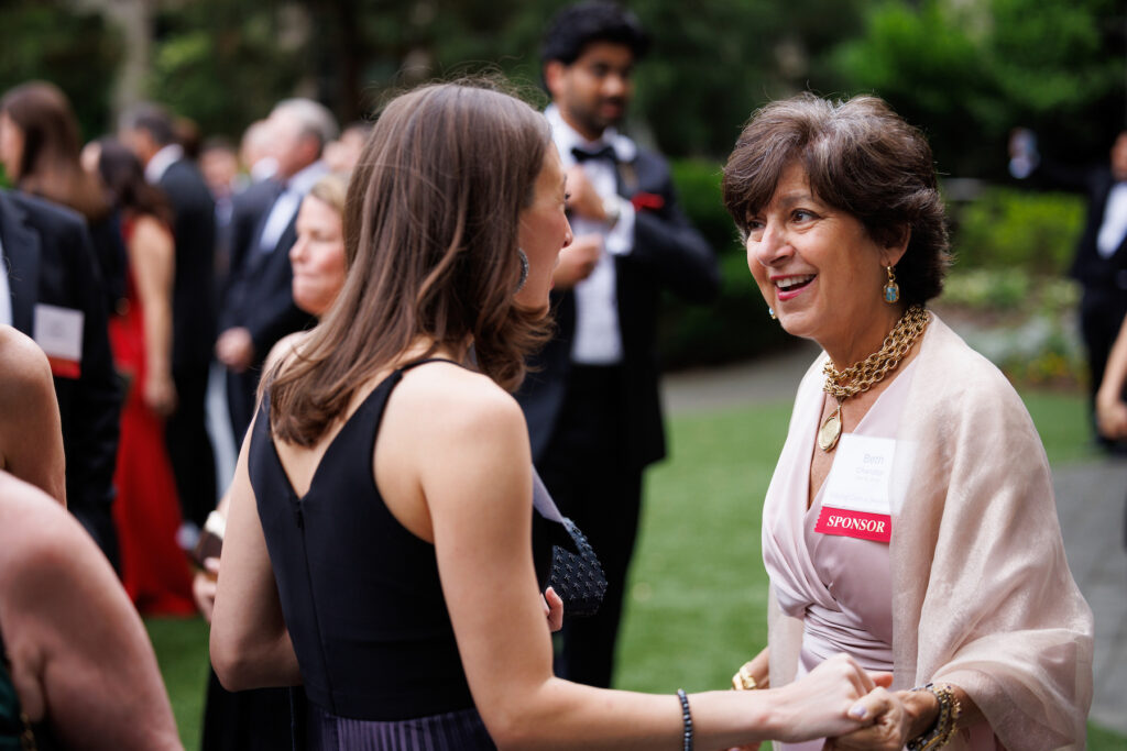 Two women greeting each other