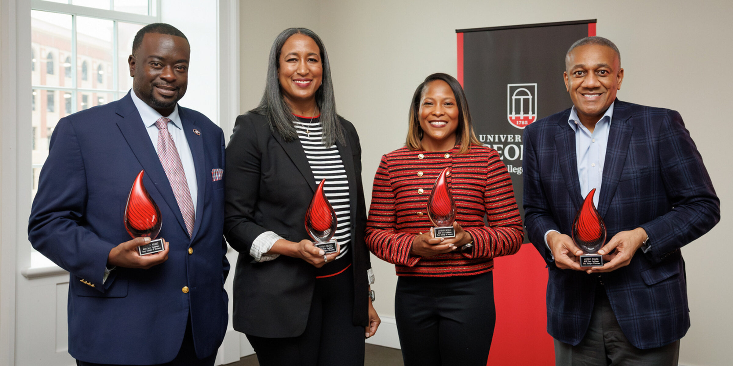 Christen Wright, Tiffany Daniels, La'Vonda McLean and Anthony Walker stand with their Terry Trailblazers Awards.