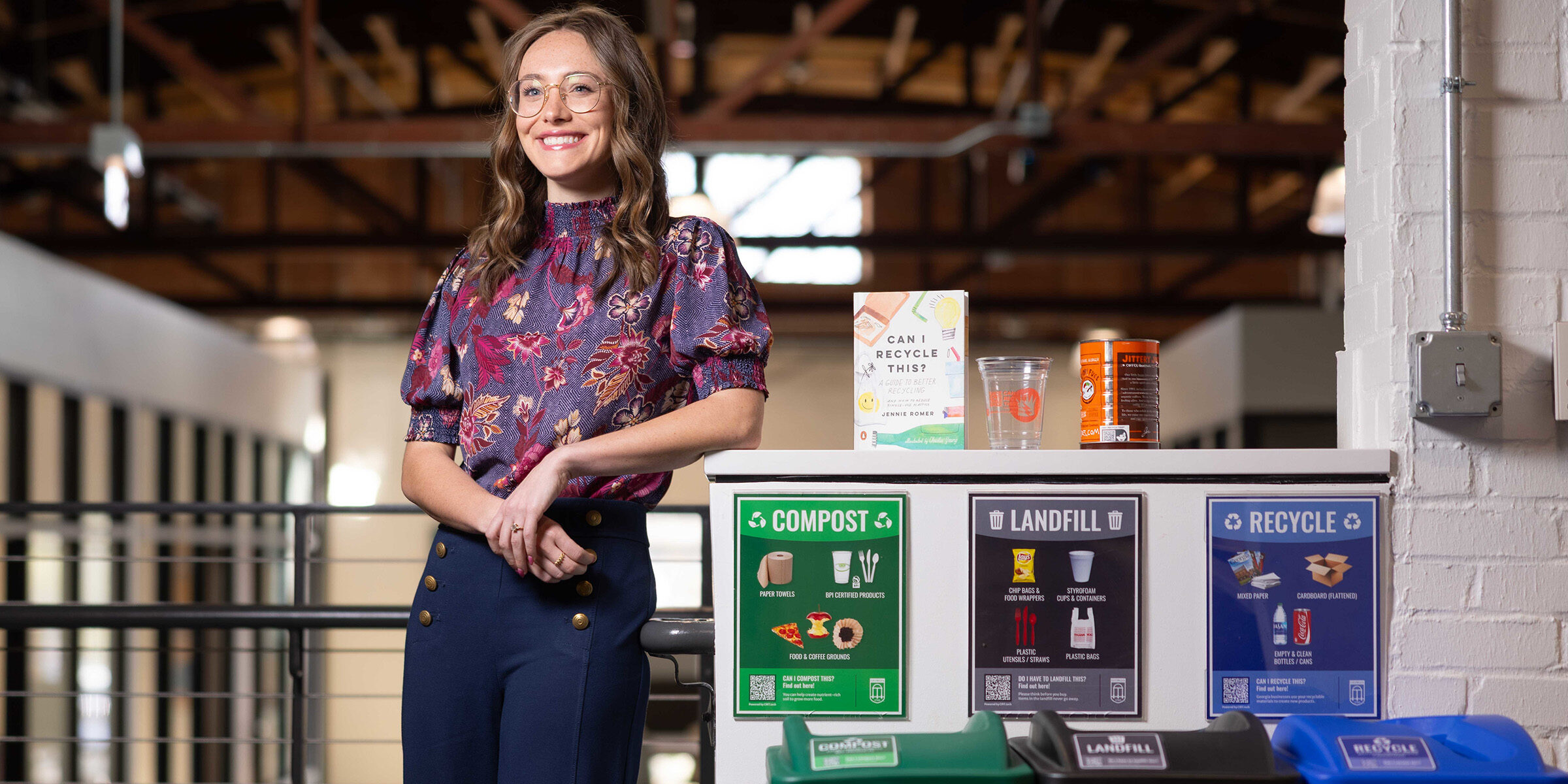 Ava Wonn poses CIRT recycling cans.