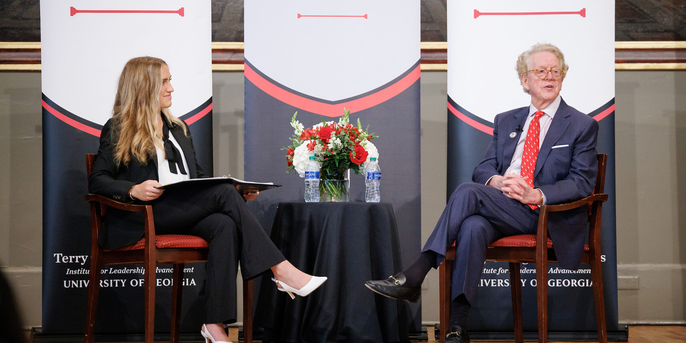 ILA Student EB Billings interviews Aflac CEO Dan Amos on stage at the UGA Chapel
