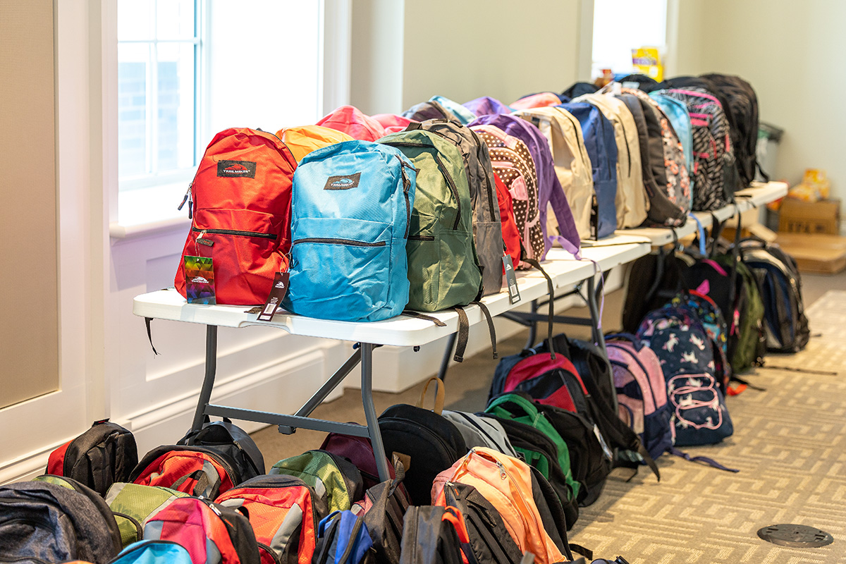 Backpacks lined up ready to be delivered to homeless service centers in Athens