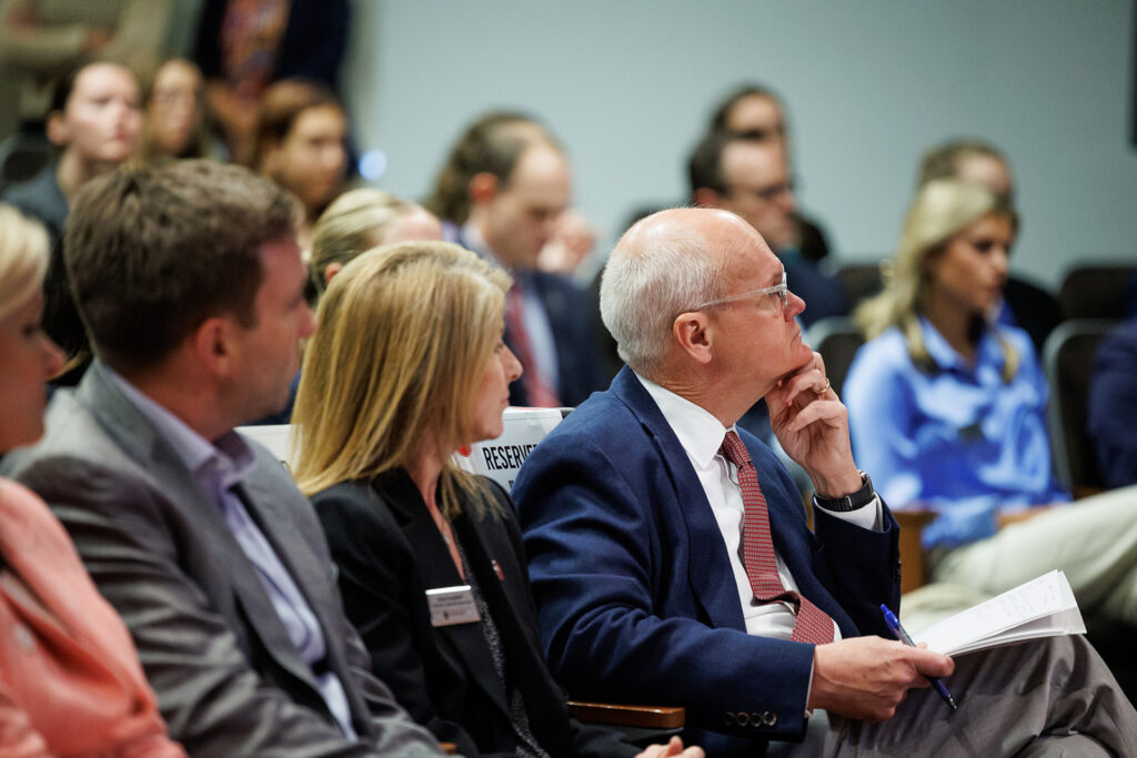 Keith Mason listens to Donna Hyland speak at the 2023 Mason Public Leadership Lecture