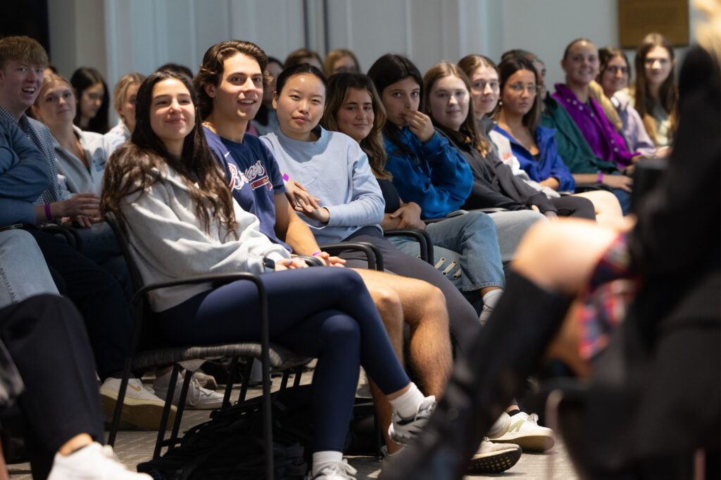 A crowd of students watches Megan Moroney speak at Terry College's Stelling Study. 