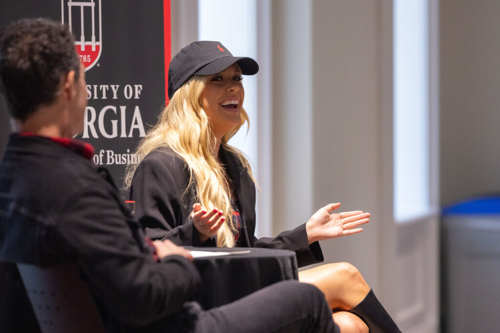 Megan Moroney laughs during an interview in front of students in front of David Barbe. 