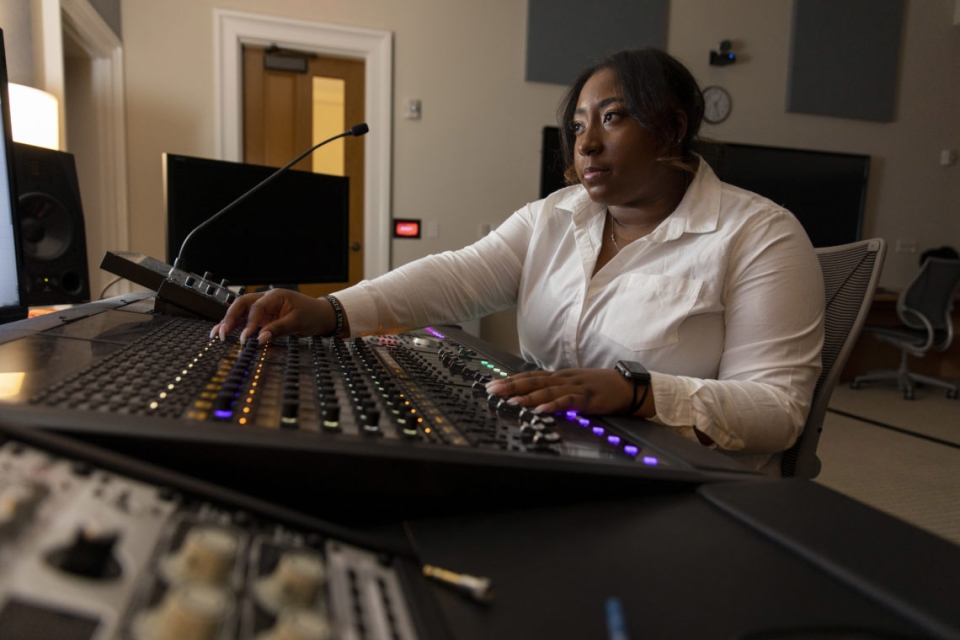 Terry College student Mikayla Coverson uses an audio mixer as part of her Music Business certificate.