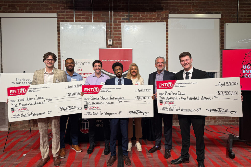 NewtTopETNR Winners of the Next Top Entrepreneurship Program pose with novelty checks