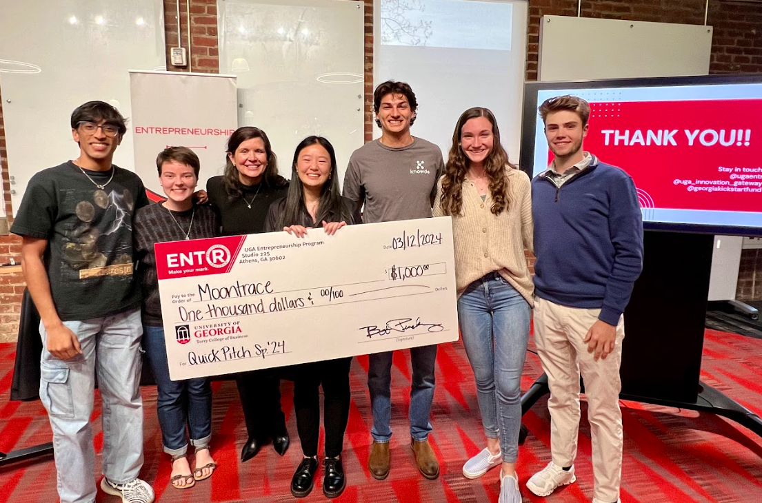 group of students receiving award check