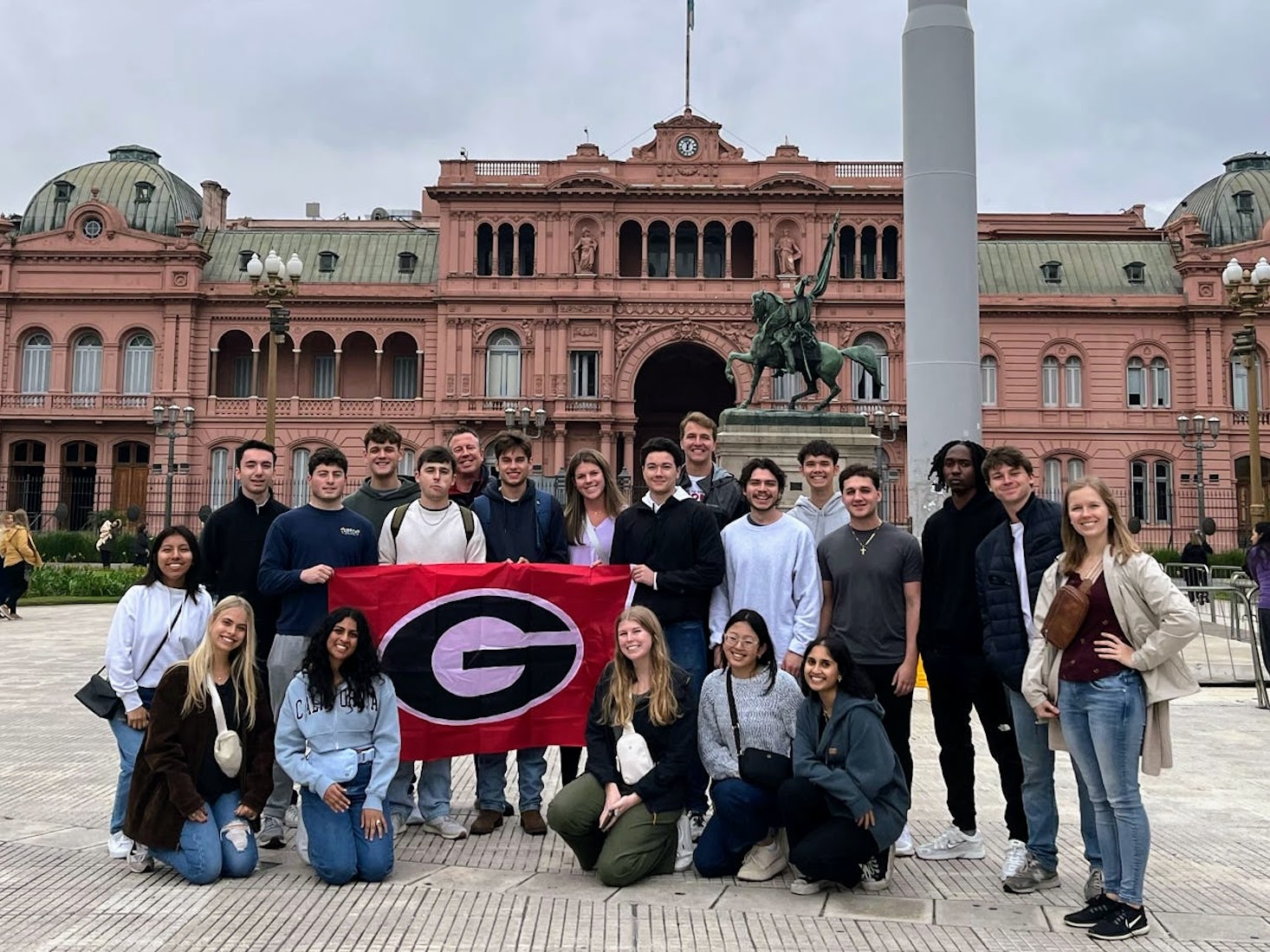 Students standing in front of historic Casa Rosado during a Terry College Study Away in Argentina