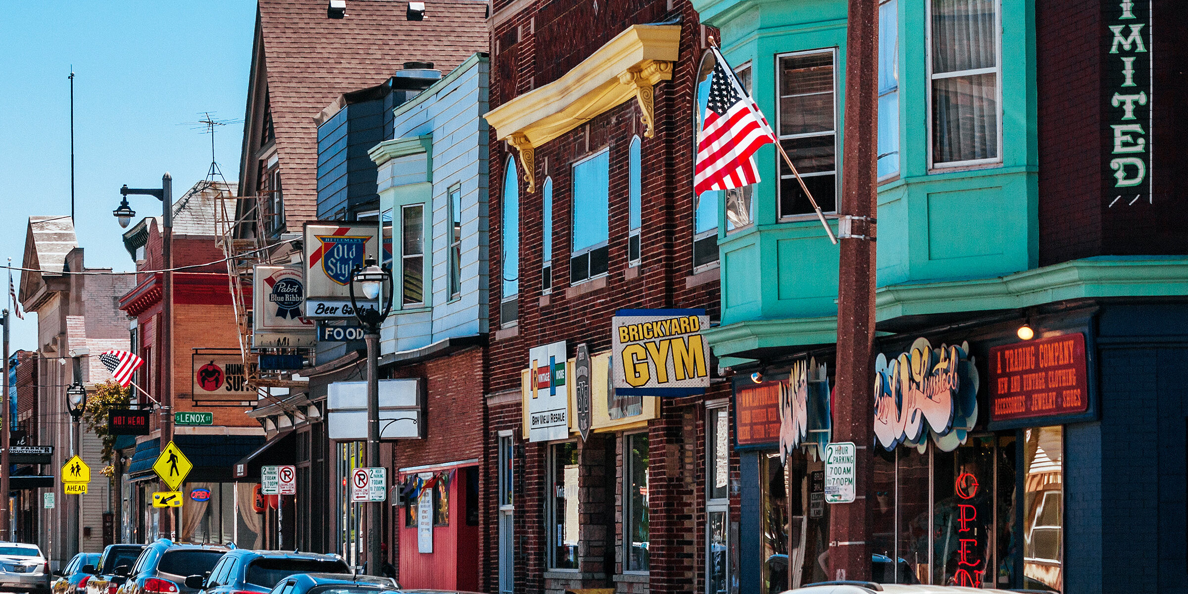Scene of an aging small town neighborhood with storefronts