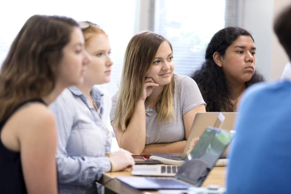 Undergraduate students listen to a lecture in the Launch Pad community.