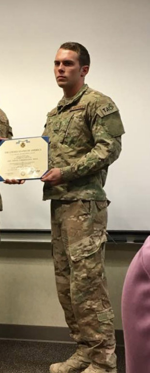 Joshua Anderson receives an award while serving in the United States Air Force.